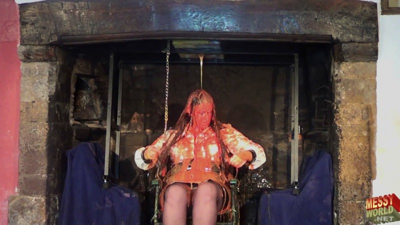 Michaela Wearing PVC in The Grand Fireplace