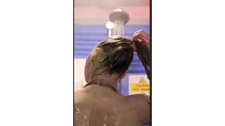 Kimberly tries to clean gunge from her hair